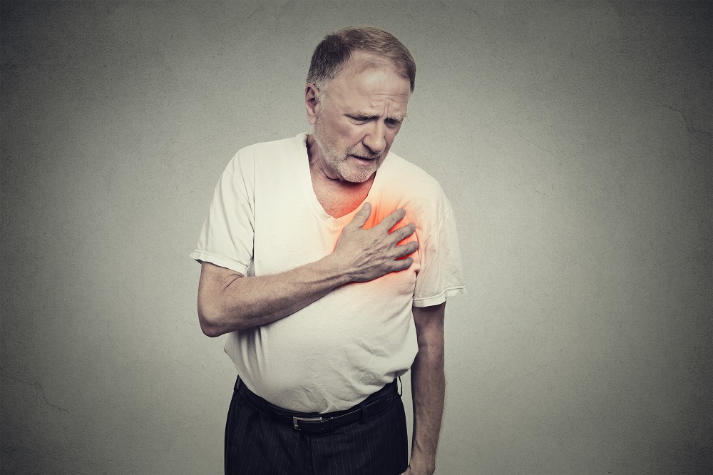elderly man experiencing pain in the chest