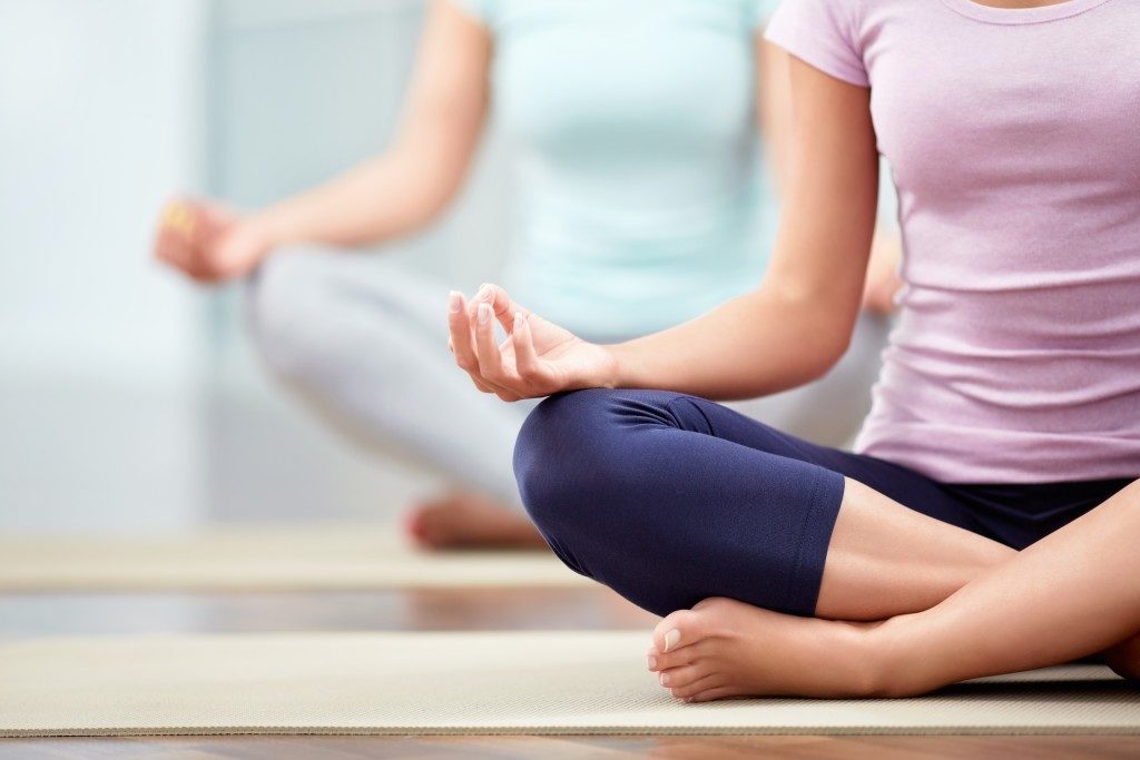 Women meditating indoors