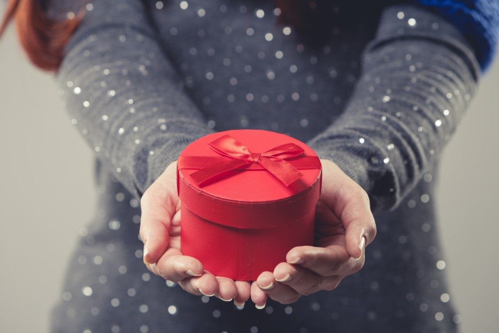 Woman handing a present