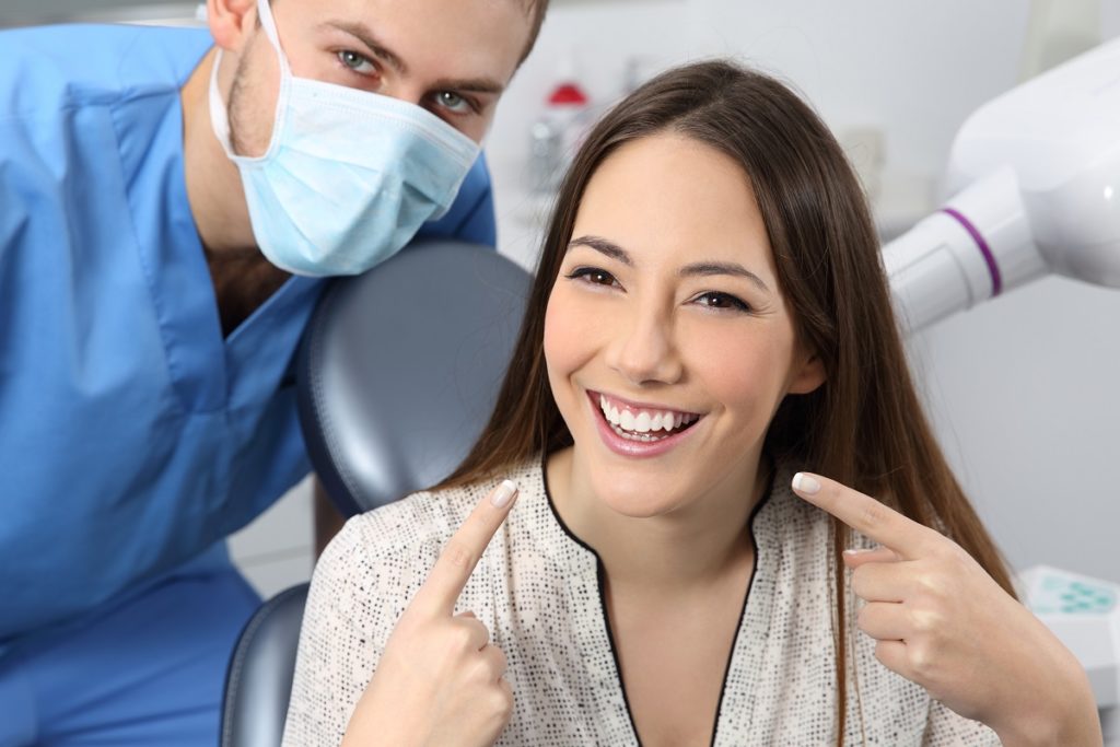 woman happy about her teeth after appointment