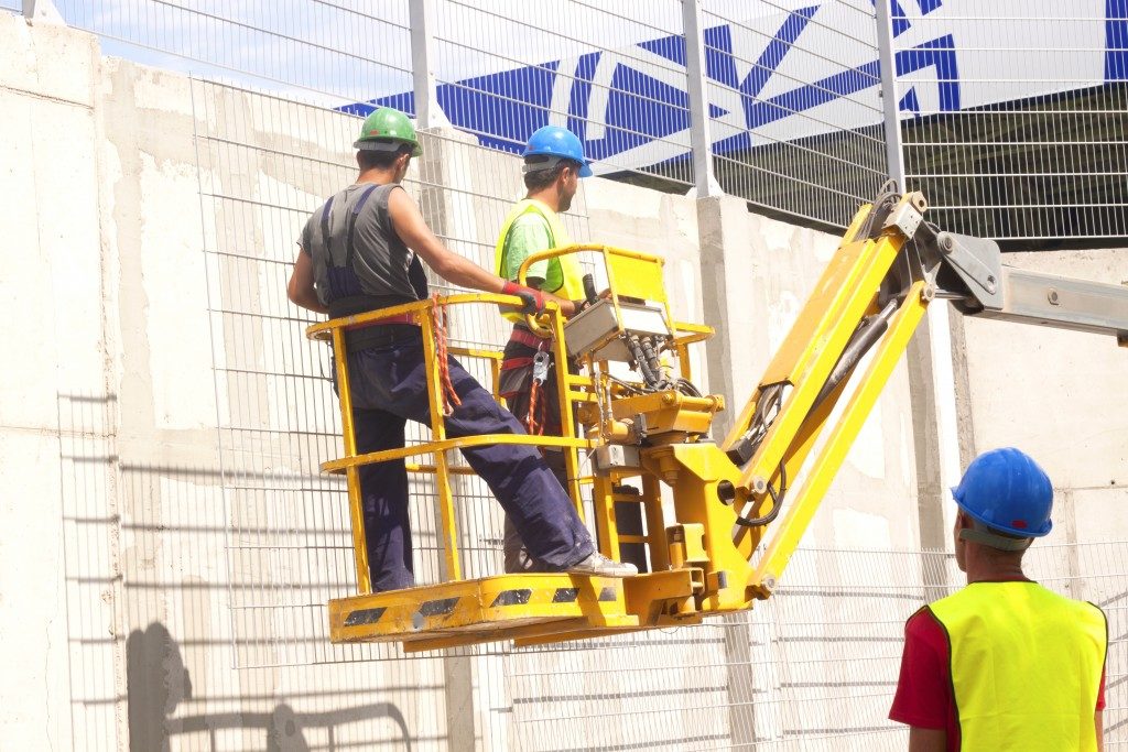 men on a mobile construction platform
